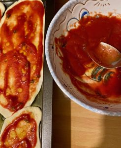 Semolina pizza tongues on an oiled baking tray ready for the oven