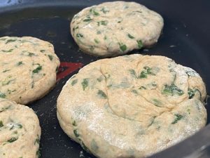 pieces of spinach dough cooking